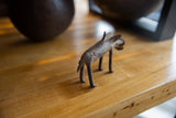 The textured back and hindquarters of the handmade bronze warthog sculpture.