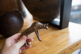 Lifestyle view of the vintage bronze warthog showing scale and texture.