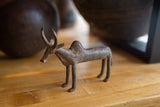 Vintage African bronze zebu collectible showing its weathered, handmade form.