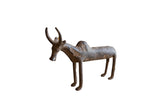 Collectible vintage African bronze zebu showing a dark, rustic patina and handmade texture.