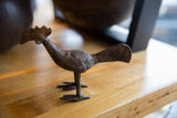 Vintage African bronze long-tailed bird showing its distinctive profile and etched surface.