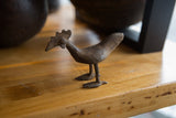 Textured, aged bronze head and neck of a vintage African bird.