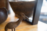 Close-up of vintage African bronze Kori Bustard bird's textured surface and patina.
