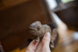 Textured head, detailed eye, and weathered patina on a vintage African bronze chameleon.