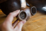 Interior view of the antique African wooden cup showing its aged, rustic texture.