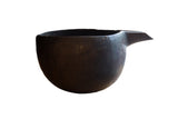 Vintage African wooden pitcher, hand-carved from dark wood with incised patterns.