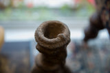 Antique African terracotta Nkisi figure's rough, hand-formed rim and hollow top.
