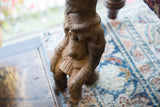 Detailed view of the antique African terracotta figure's textured, earthy brown surface.