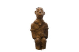Antique African Nkisi terracotta figure, handmade with earthy texture, head visibly sits atop.