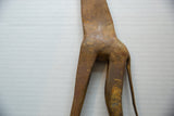 Etched details and aged patina on the bronze alloy hindquarters of the vintage giraffe.