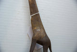 Handmade charm seen in the textured spot details on the bronze giraffe sculpture.