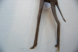 Slender, hand-formed bronze legs and tail of the vintage African giraffe sculpture.