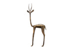 Vintage African bronze gazelle sculpture facing left with an elegant long neck and aged patina.