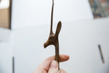 Close-up of the gazelle's head showing the rich patina and hand-cast texture.