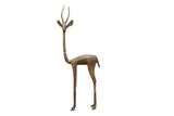 Vintage African bronze alloy gazelle sculpture, left facing with natural aged patina.