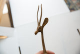 Left-facing vintage African bronze gazelle head, displaying rich, textured patina.