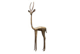 Vintage African bronze left-facing gazelle sculpture with a stylized, elongated body.
