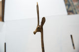 Close-up of the vintage bronze gazelle head in profile showing its slender horns.