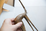 Vintage African bronze gazelle body and legs, showing rustic patina and white string.