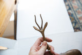 Vintage African bronze gazelle's unique, textured handmade antlers.