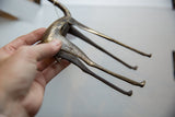 Underside view of the vintage African bronze gazelle showing its hand-cast texture.