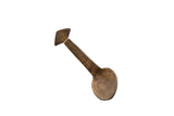 Vintage handmade African wooden spoon with incised geometric patterns and a rich, aged patina.