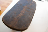 Hand-carved dark wood top of the vintage African Senufo milk stool, blue patina.