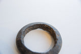 Hand-carved texture and uneven inner edge of the antique marble bracelet.