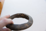 The textured, hand-carved surface of the ancient marble bracelet showing its unique patina.