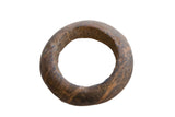 Hand-carved Neolithic marble bracelet with a thick form and mottled, earthy brown texture.