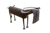 Collectible vintage African buffalo sculpture, dark brown, with carved concentric circle patterns.