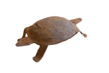 Vintage African iron turtle collectible with a weathered, rustic brown patina.