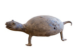 A vintage handmade African turtle sculpture with a dark, aged patina and carved shell.