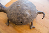 Angled view of the vintage turtle's back showing carved line patterns and its curled tail.