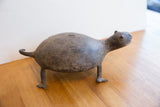 Vintage African turtle collectible shown in profile, highlighting its textured shell.