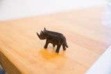 Dark patina and handmade texture on the vintage African rhino sculpture.