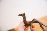 Close-up of vintage African camel head, highlighting rich, aged dark patina.