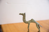 Handmade vintage camel sculpture head with unique texture and greenish patina.