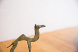 Detail shot of vintage African camel sculpture, highlighting its time-softened finish.