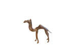 Vintage African camel sculpture with a stylized form and a dark, weathered patina.