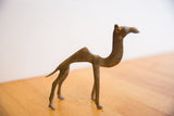 The stylized handmade form and aged patina of the vintage African camel.