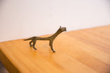 Vintage African cheetah sculpture with a stylized, elongated neck and body.