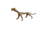 Vintage African oxidized cheetah sculpture with a stylized, elongated body and weathered patina.