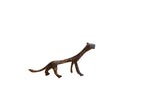 Vintage handmade African cheetah sculpture with an elongated form and dark patina.