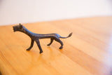 Elongated body and textured dark patina of the vintage African cheetah sculpture.