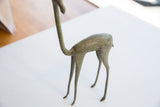 Rear view of the African gazelle showing its curved form and textured oxidized finish.