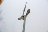 Vintage African gazelle's right-facing head, textured with a verdigris and bronze patina.