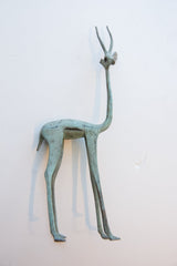 Vintage African gazelle figure's body and slender legs with green patina.