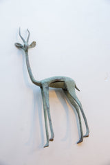 Close-up of the vintage African gazelle's head and long neck with time-softened blue-green tones.