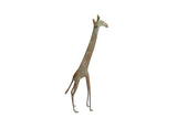 Vintage African giraffe sculpture with a slender body and oxidized green patina.